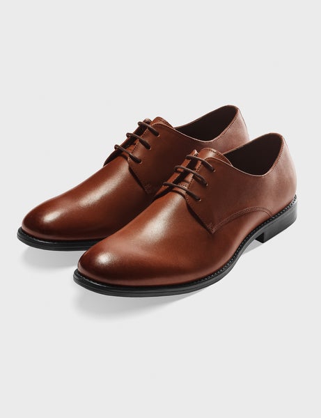 black tuxedo and brown shoes