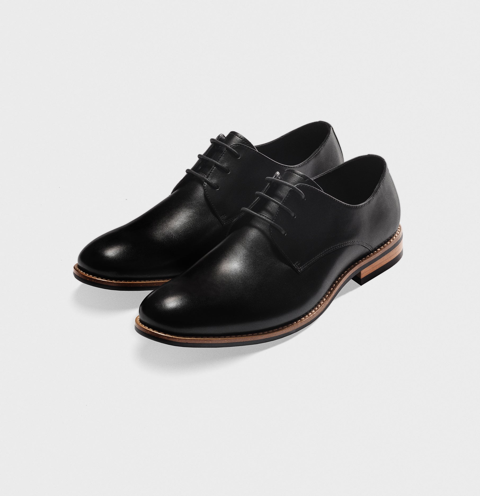 black dress shoes with white soles